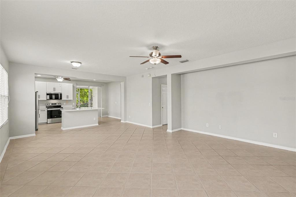 531 Cressa Circle Cocoa, FL 32926 - Photo 5 of 16 a view of an empty room with kitchen and stove top oven