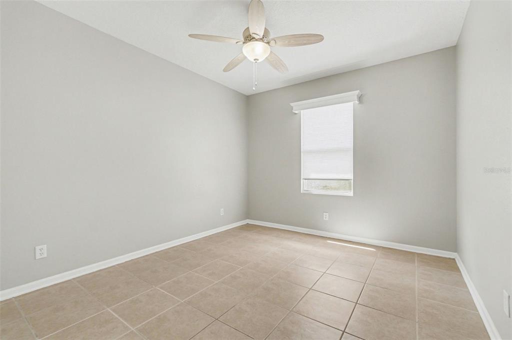 531 Cressa Circle Cocoa, FL 32926 - Photo 10 of 16 an empty room with windows and fan
