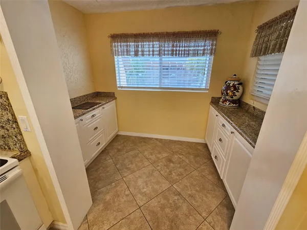 a bathroom with a sink a vanity and a mirror