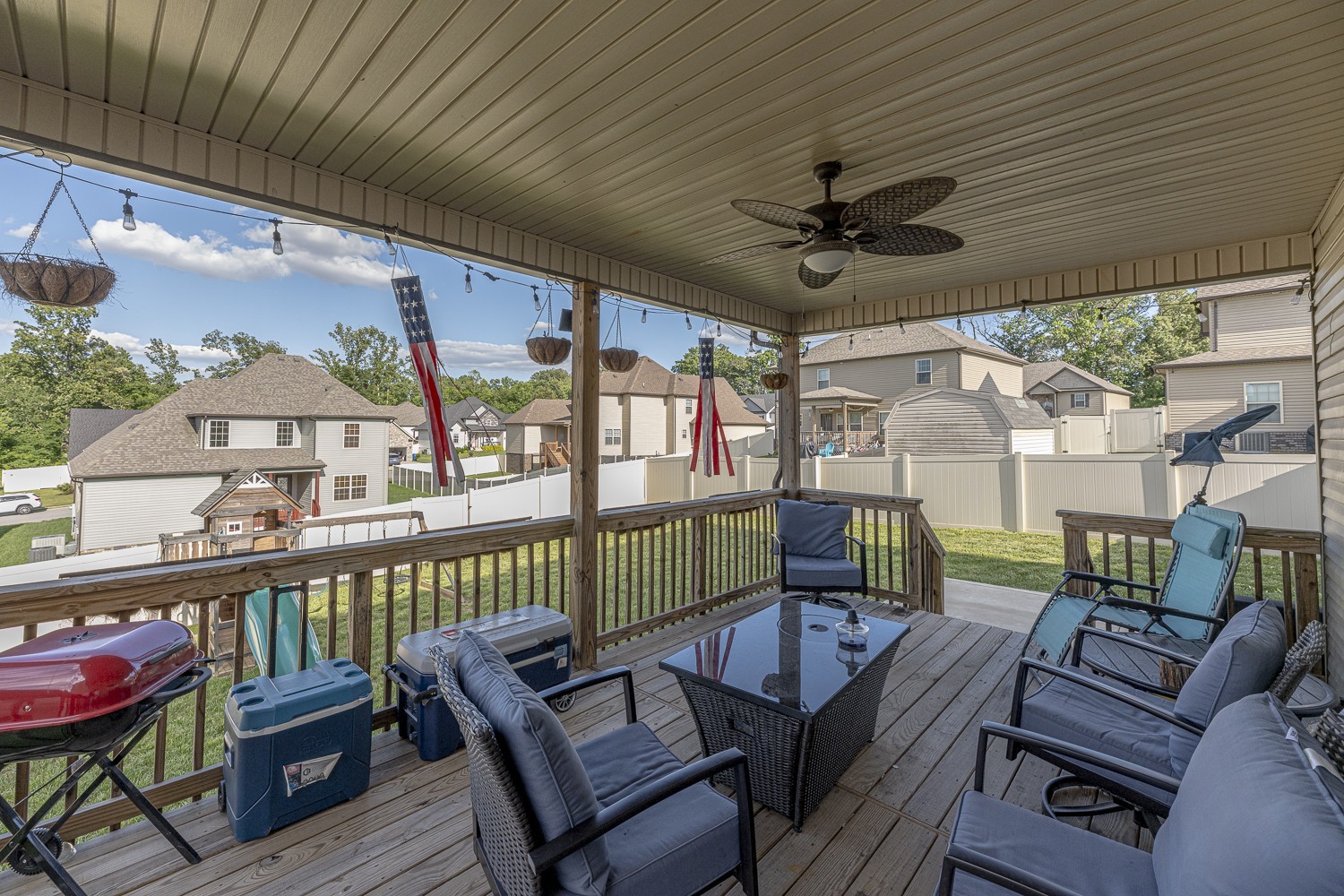 305 Winter Terrace Lane Clarksville, TN 37040 - Photo 11 of 38 a view of a patio with couches chairs potted plants and a dining table with chairs