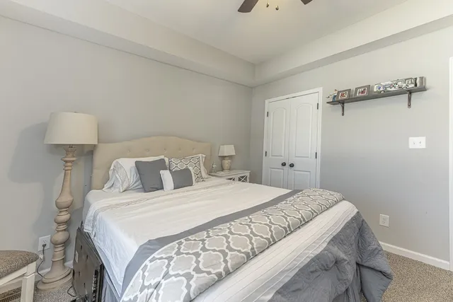 a bedroom with a bed and a bathroom