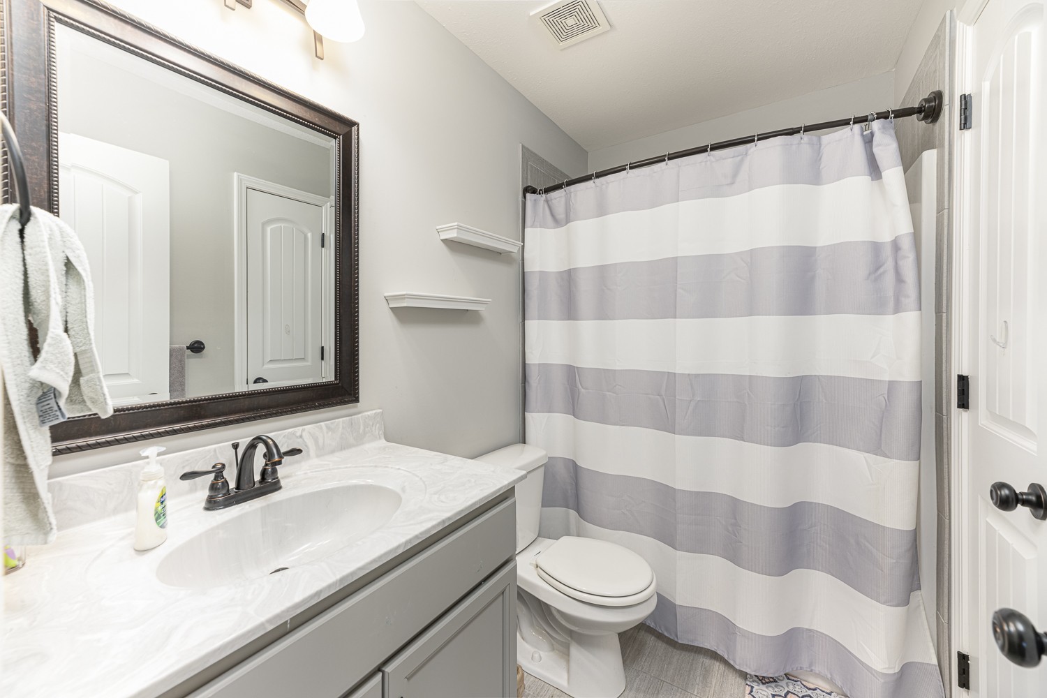 305 Winter Terrace Lane Clarksville, TN 37040 - Photo 31 of 38 a bathroom with a sink and a mirror