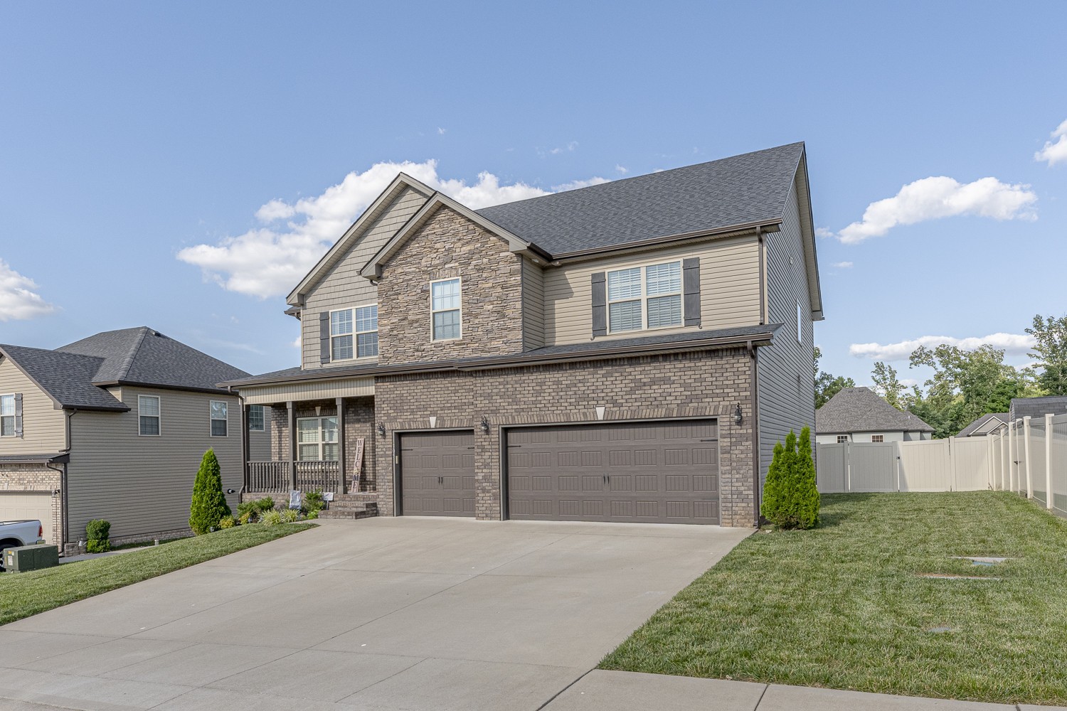 305 Winter Terrace Lane Clarksville, TN 37040 - Photo 4 of 38 a front view of a house with a garden and garage