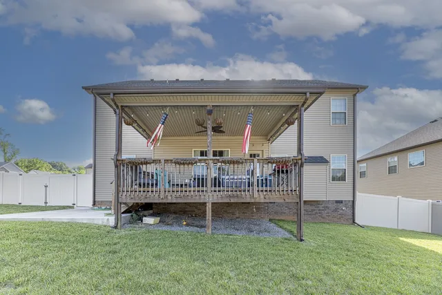 a view of backyard with deck and deck