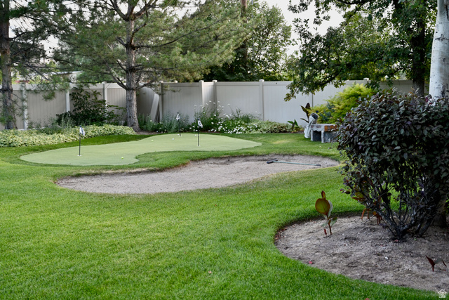 314 Brown Farm Lane Draper, UT 84020 - Photo 42 of 57 Private backyard featuring a putting green with multiple holes, a sand trap, and lush green lawn