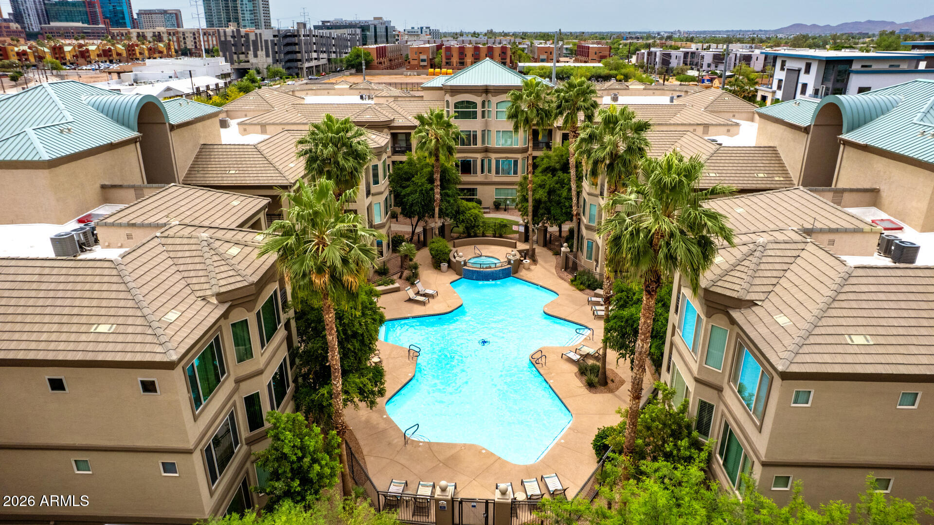 an aerial view of multiple houses with yard