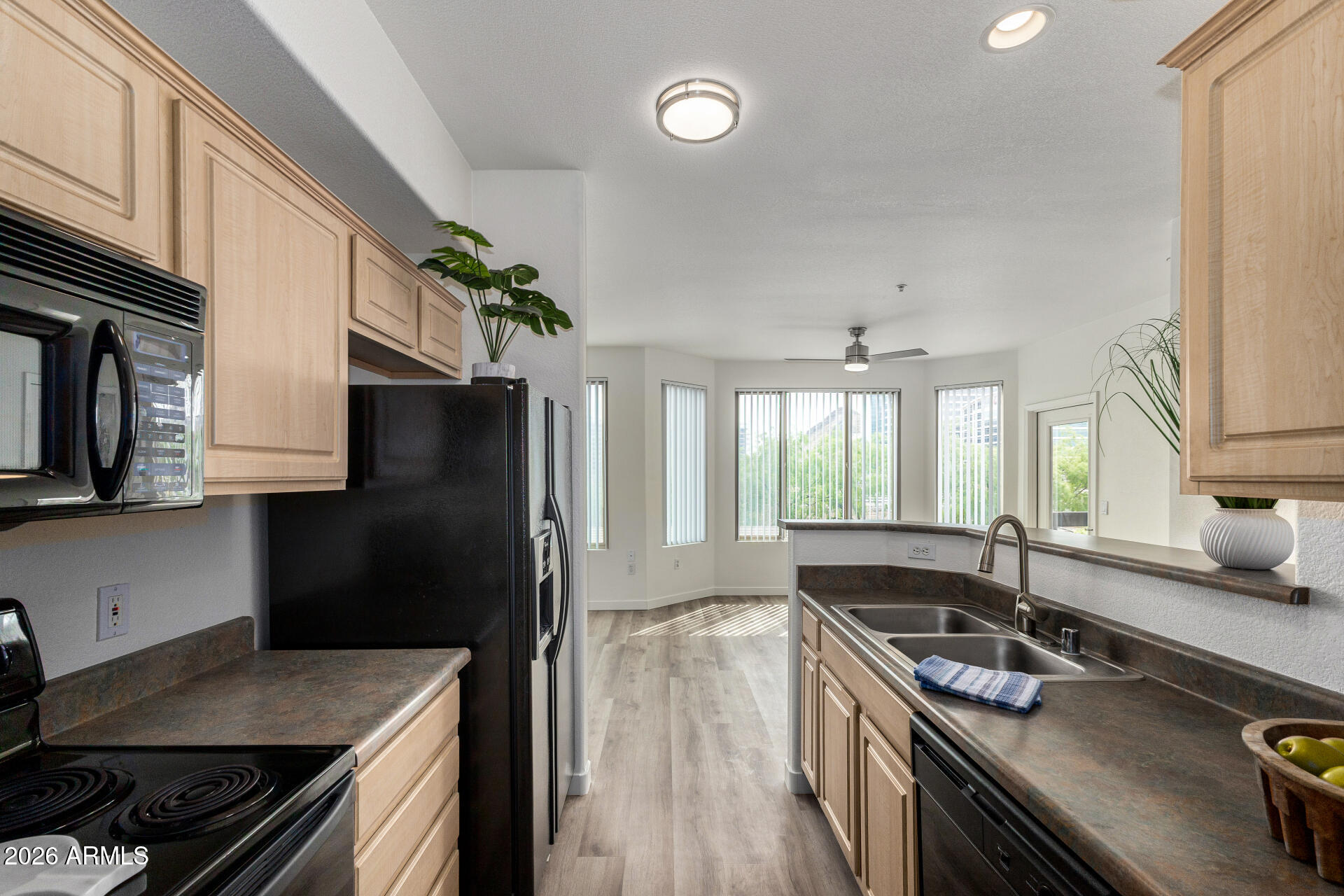 435 West Rio Salado Parkway, Unit 305 Tempe, AZ 85281 - Photo 21 of 44 a kitchen with stainless steel appliances granite countertop a sink stove and refrigerator