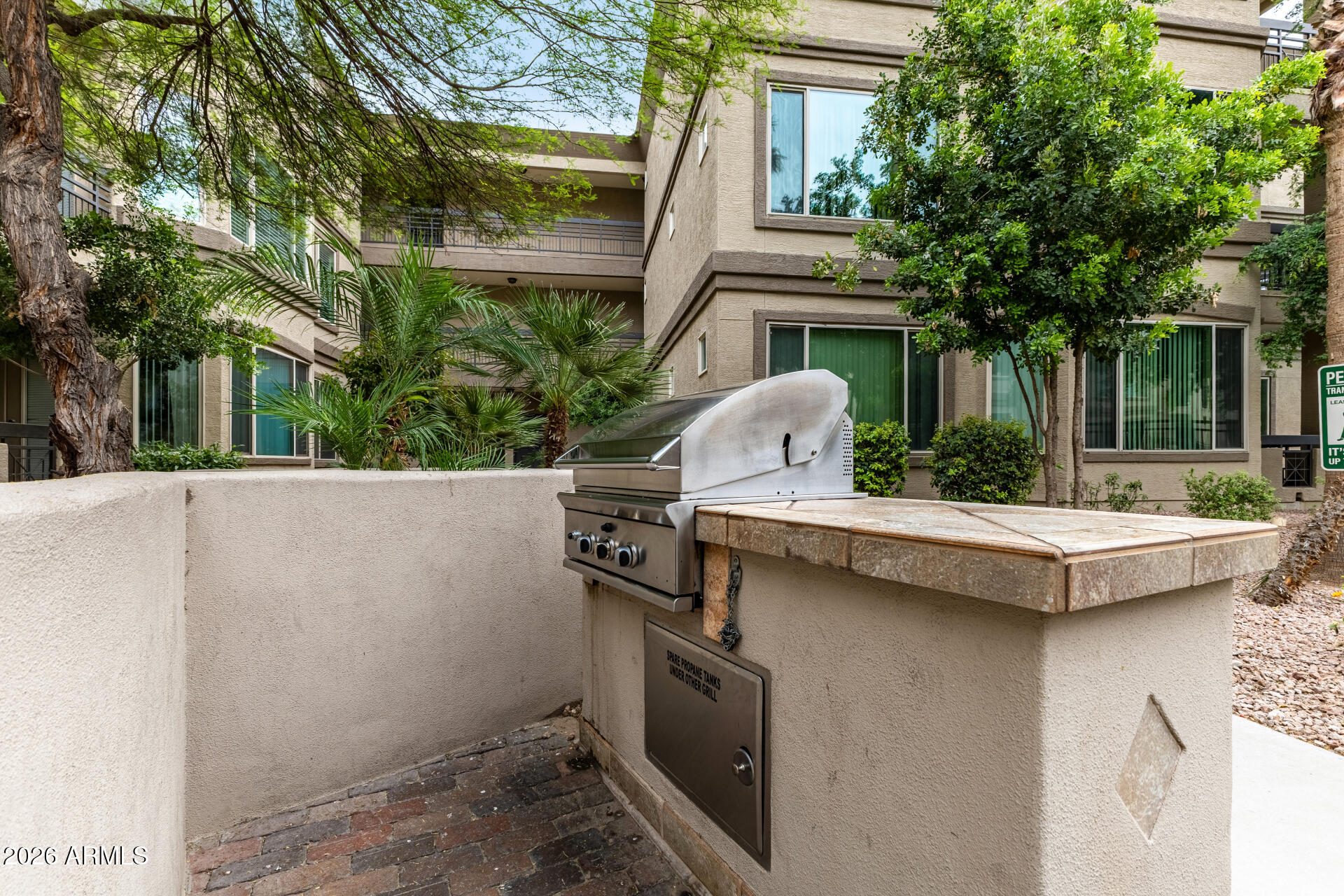 435 West Rio Salado Parkway, Unit 305 Tempe, AZ 85281 - Photo 28 of 44 a view of a patio with table and chairs with wooden fence and plants