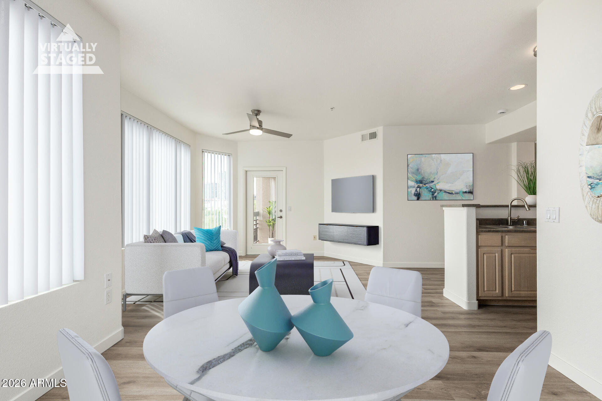 435 West Rio Salado Parkway, Unit 305 Tempe, AZ 85281 - Photo 3 of 44 a living room with furniture and a wooden floor