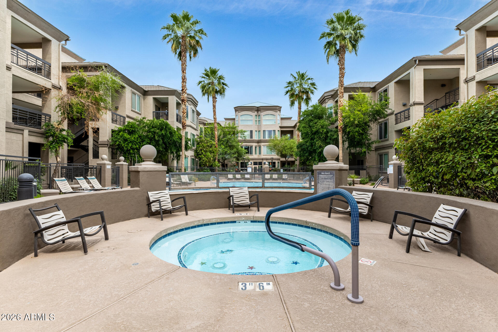 435 West Rio Salado Parkway, Unit 305 Tempe, AZ 85281 - Photo 31 of 44 a swimming pool with outdoor seating and a potted plant