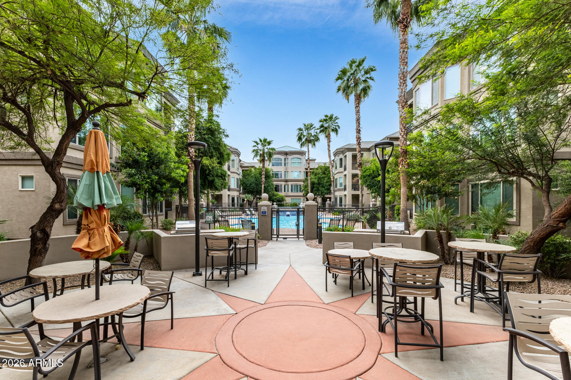 435 West Rio Salado Parkway, Unit 305 Tempe, AZ 85281 - Photo 33 of 44 a outdoor space with lots of tables a chairs and a potted plant
