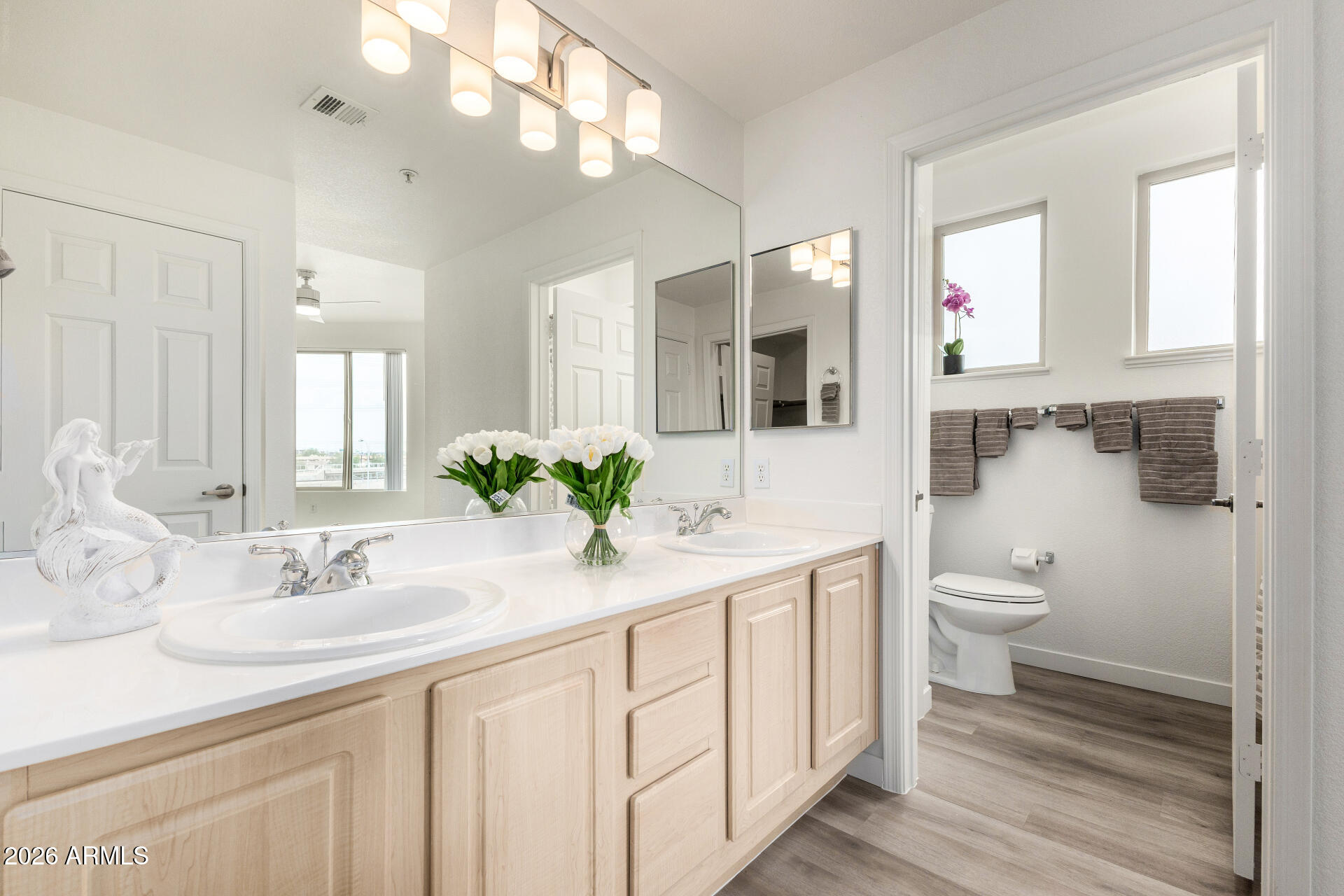 435 West Rio Salado Parkway, Unit 305 Tempe, AZ 85281 - Photo 7 of 44 a bathroom with a granite countertop sink a toilet and a mirror