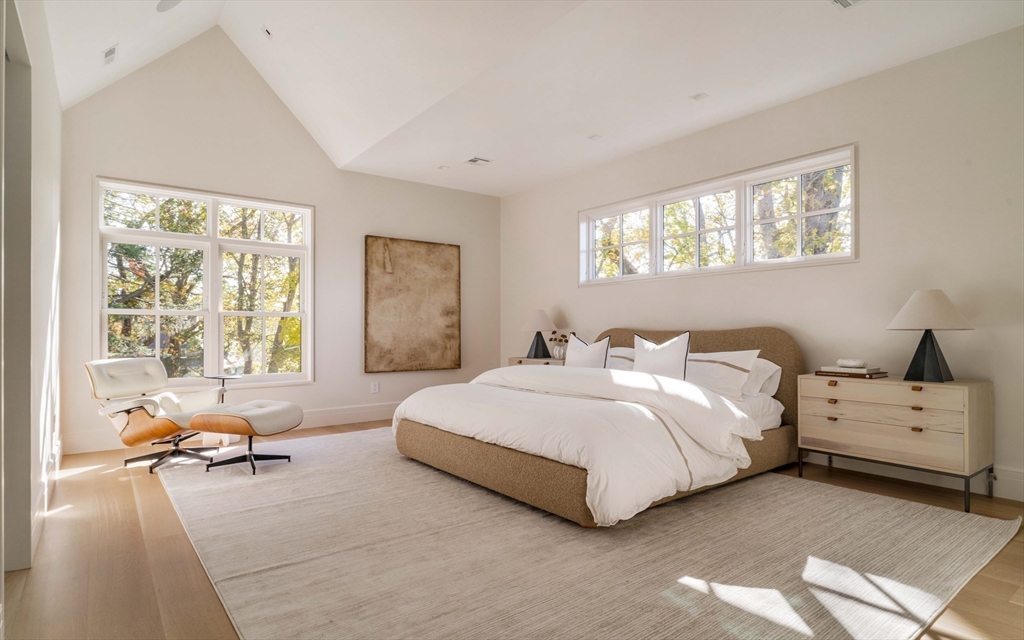 115 Windsor Road Newton, MA 02468 - Photo 25 of 42 a spacious bedroom with a bed and glass window