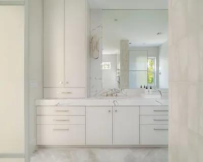 a bathroom with a sink vanity and mirror
