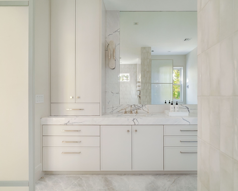115 Windsor Road Newton, MA 02468 - Photo 27 of 42 a bathroom with a sink vanity and mirror