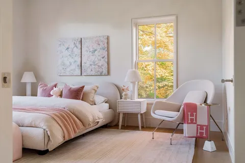 a bedroom with a bed and a couch