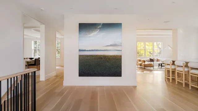 a view of a livingroom with furniture and a fireplace