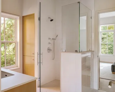 a bathroom with a tub and shower
