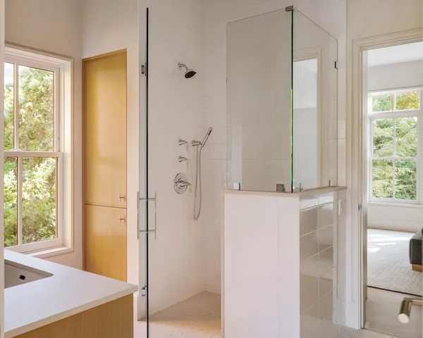 a bathroom with a tub and shower