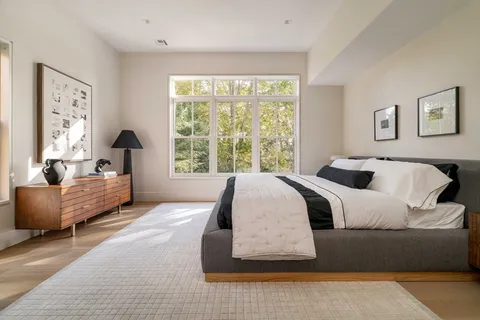 a bedroom with a large bed and a couch