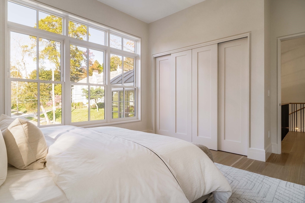 115 Windsor Road Newton, MA 02468 - Photo 34 of 42 a bedroom with a large bed and a large window