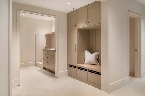 a living room with stainless steel appliances kitchen island
