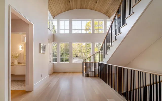 a view of an entryway with wooden floor