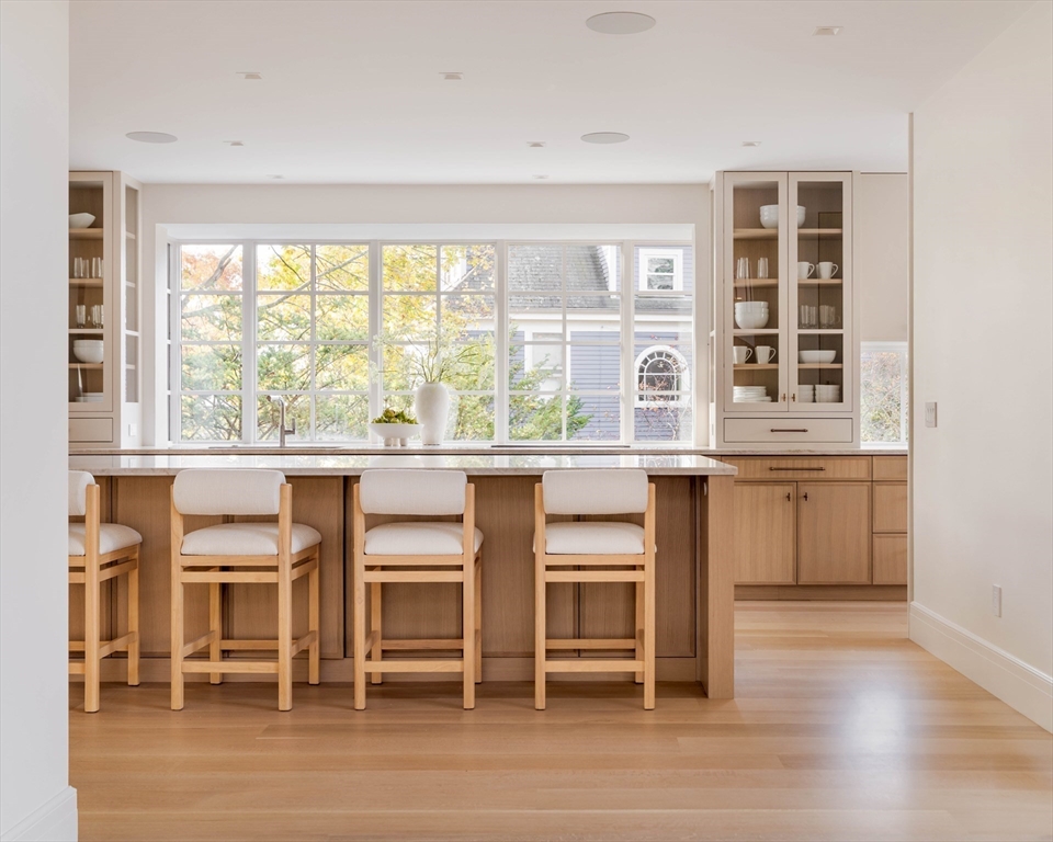 115 Windsor Road Newton, MA 02468 - Photo 7 of 42 a kitchen with a table chairs and a window