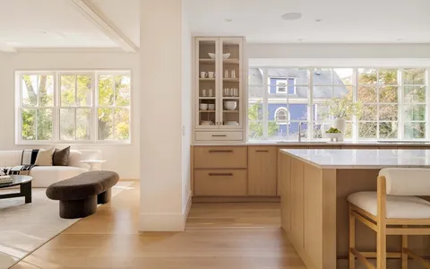 a kitchen with a stove a sink and a refrigerator