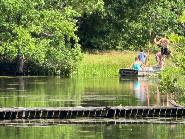 a view of a lake with a house in the background