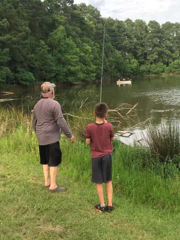 a floor to ceiling window and a table in the river