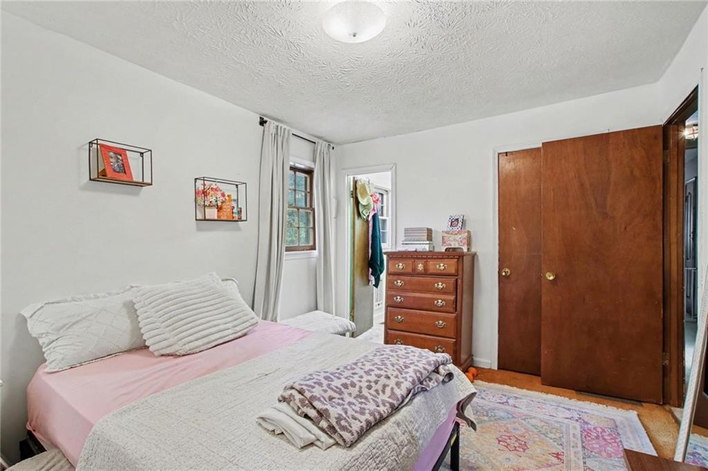 845 Idlewood Road Winder, GA 30680 - Photo 16 of 25 a bedroom with a bed and a closet