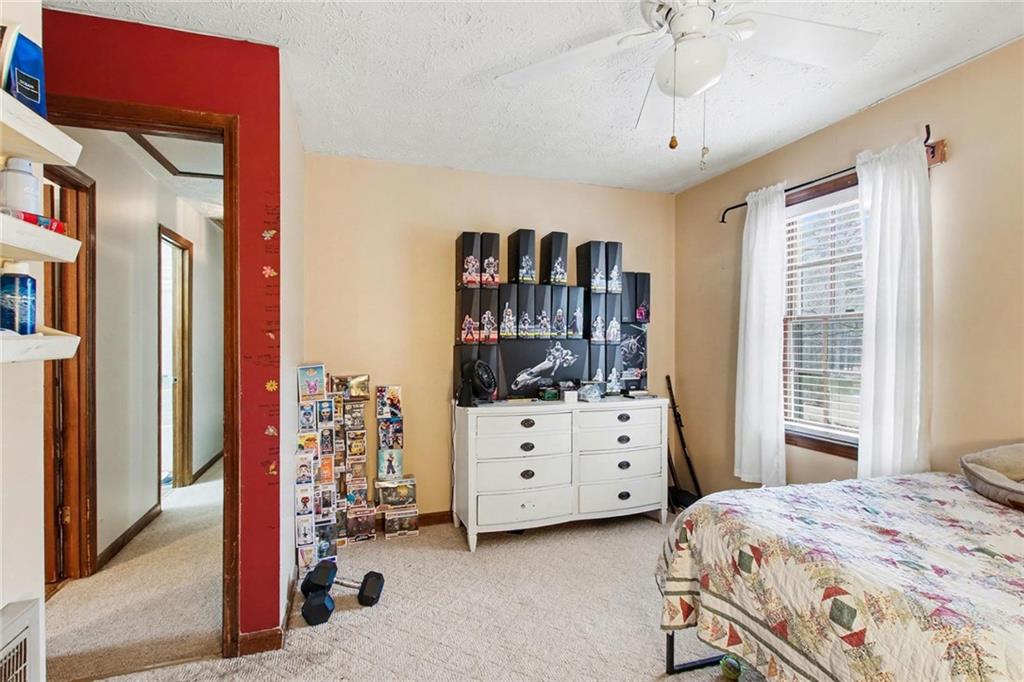 845 Idlewood Road Winder, GA 30680 - Photo 20 of 25 a bedroom with a bed and a window