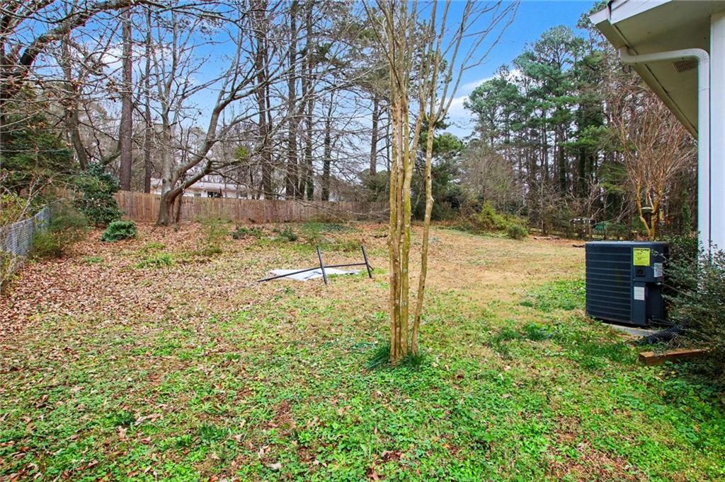 845 Idlewood Road Winder, GA 30680 - Photo 22 of 25 a backyard of a house with lots of green space