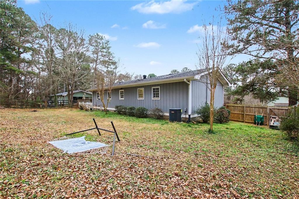 845 Idlewood Road Winder, GA 30680 - Photo 23 of 25 a view of a backyard with a tree