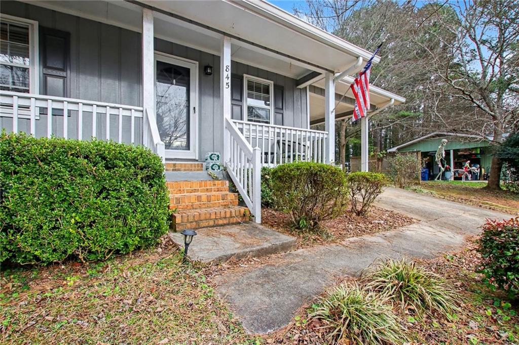 845 Idlewood Road Winder, GA 30680 - Photo 4 of 25 a front view of a house with a yard