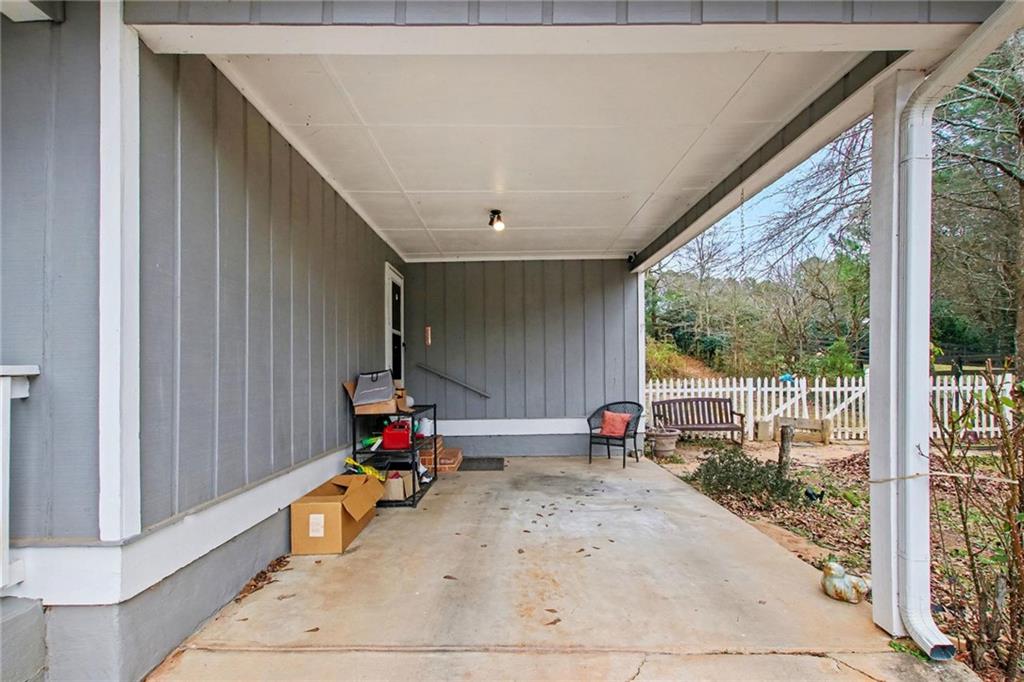 845 Idlewood Road Winder, GA 30680 - Photo 5 of 25 a view of living room with porch and furniture