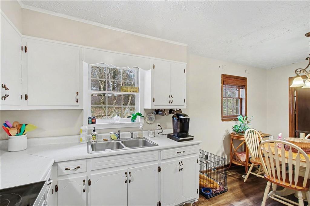 845 Idlewood Road Winder, GA 30680 - Photo 10 of 25 a kitchen with a sink cabinets and window