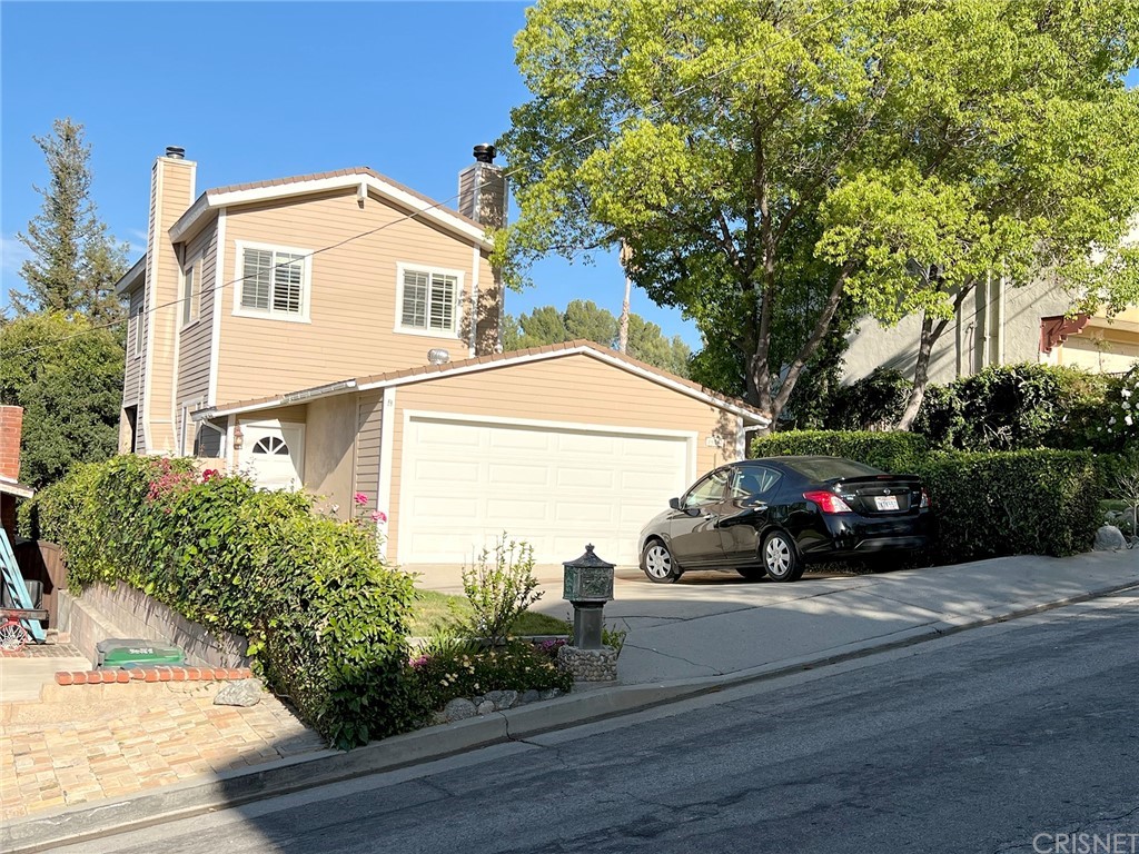 a view of a car in front of a house