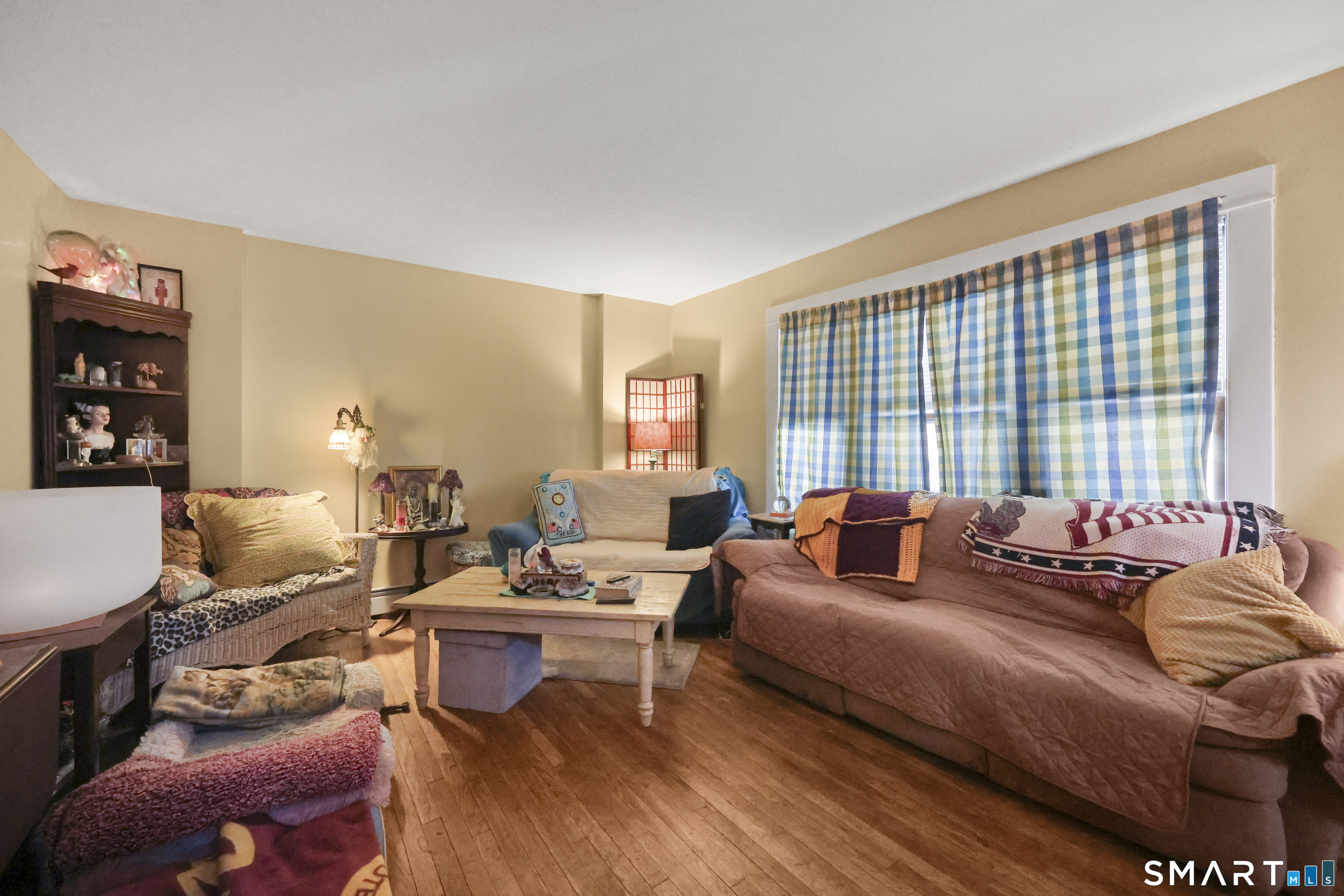 57 Foxon Place New Britain, CT 06053 - Photo 11 of 40 a living room with furniture and a large window
