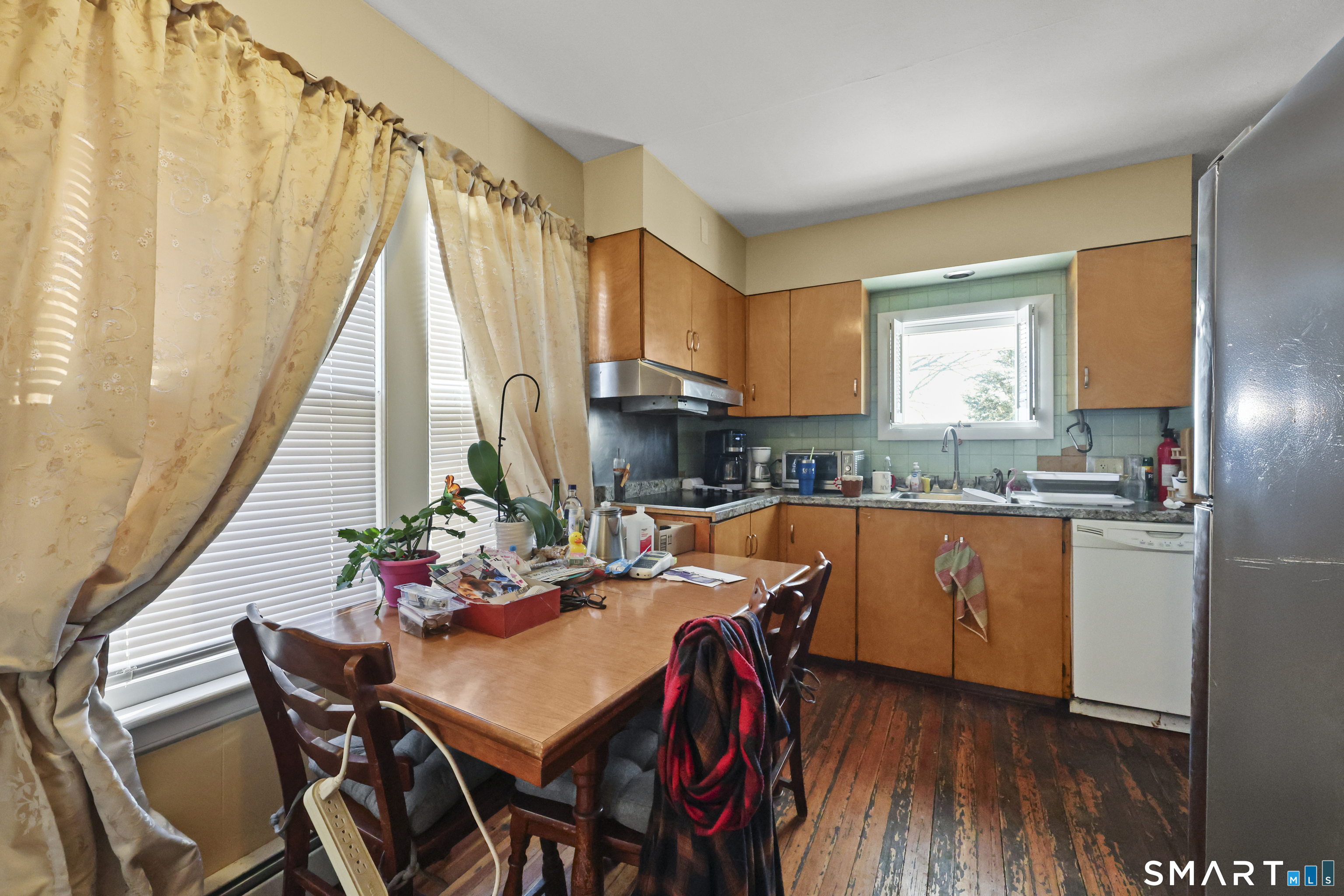 57 Foxon Place New Britain, CT 06053 - Photo 12 of 40 a view of a dining room with furniture window and wooden floor