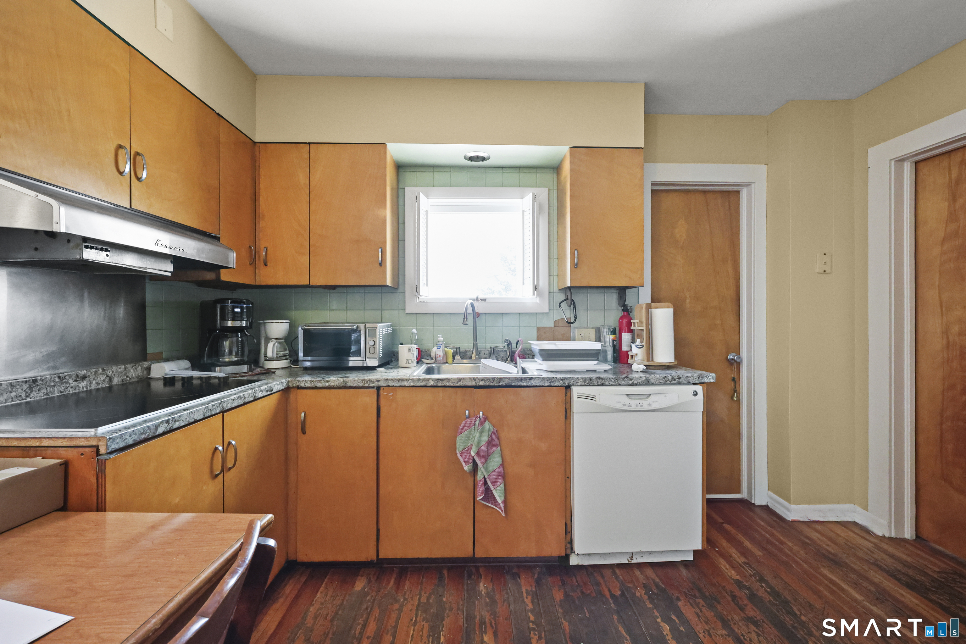 57 Foxon Place New Britain, CT 06053 - Photo 13 of 40 a kitchen with stainless steel appliances granite countertop a sink and cabinets