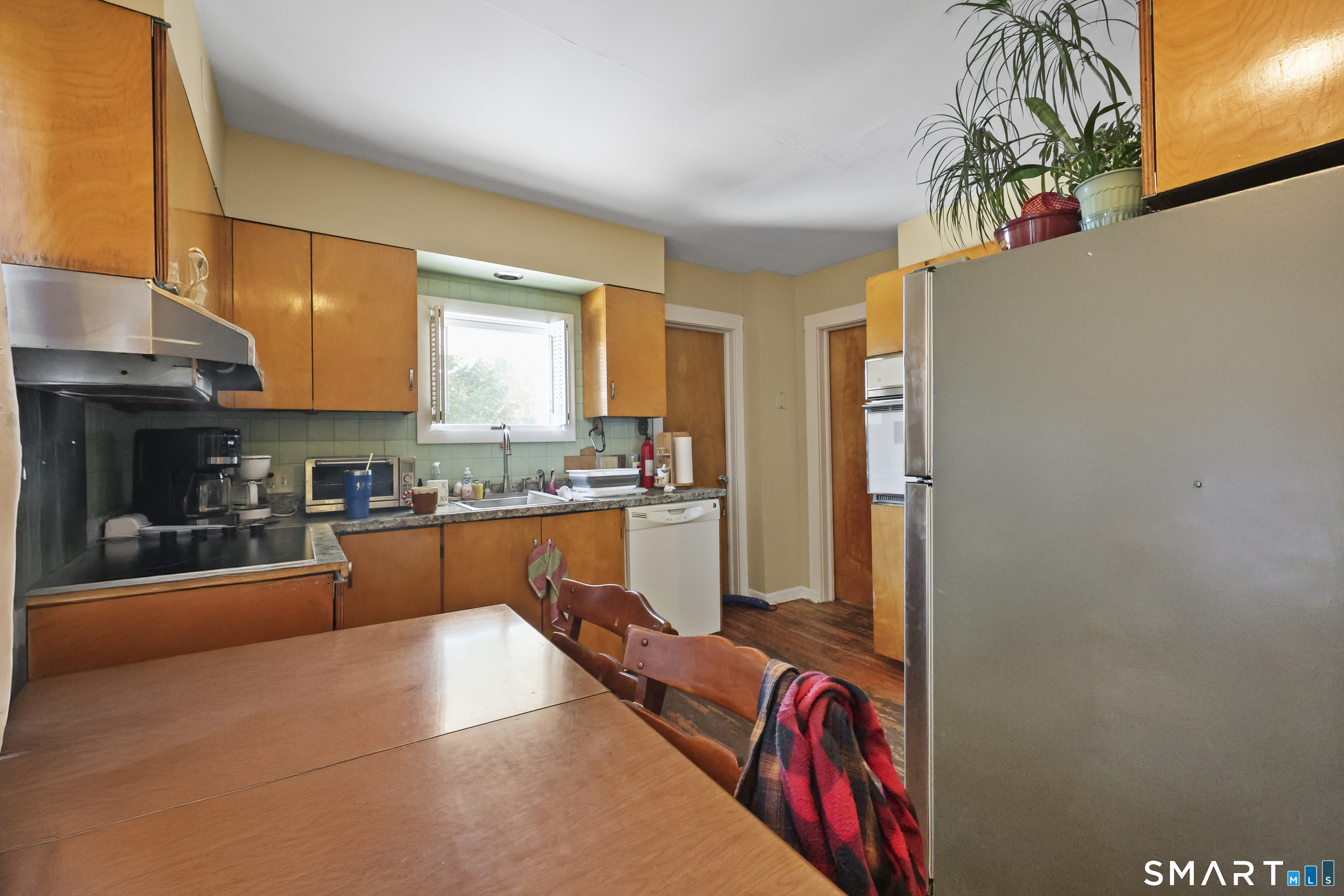 57 Foxon Place New Britain, CT 06053 - Photo 14 of 40 a kitchen with stainless steel appliances granite countertop a refrigerator and a stove top oven