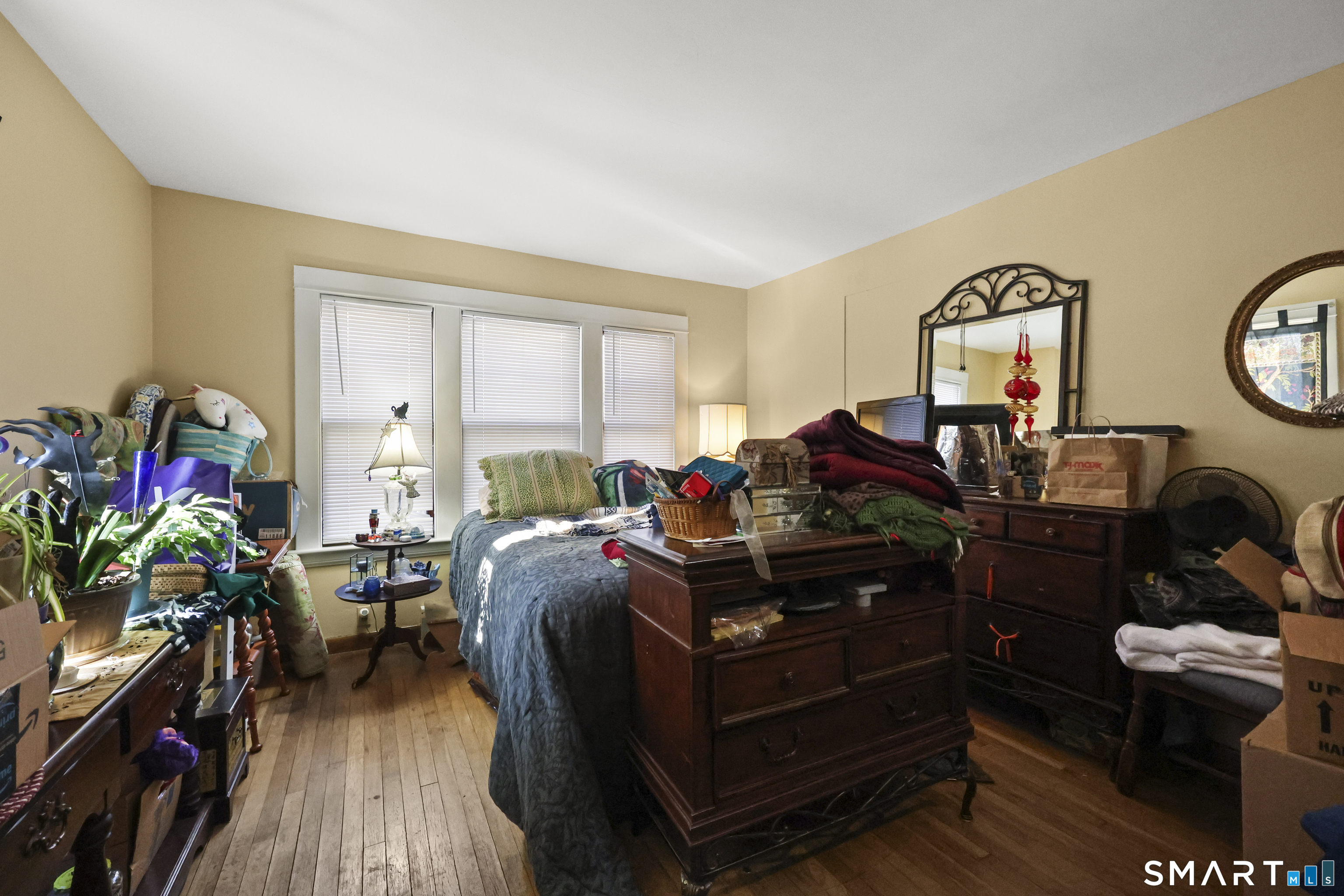 57 Foxon Place New Britain, CT 06053 - Photo 19 of 40 a living room with furniture a wooden floor and a fireplace