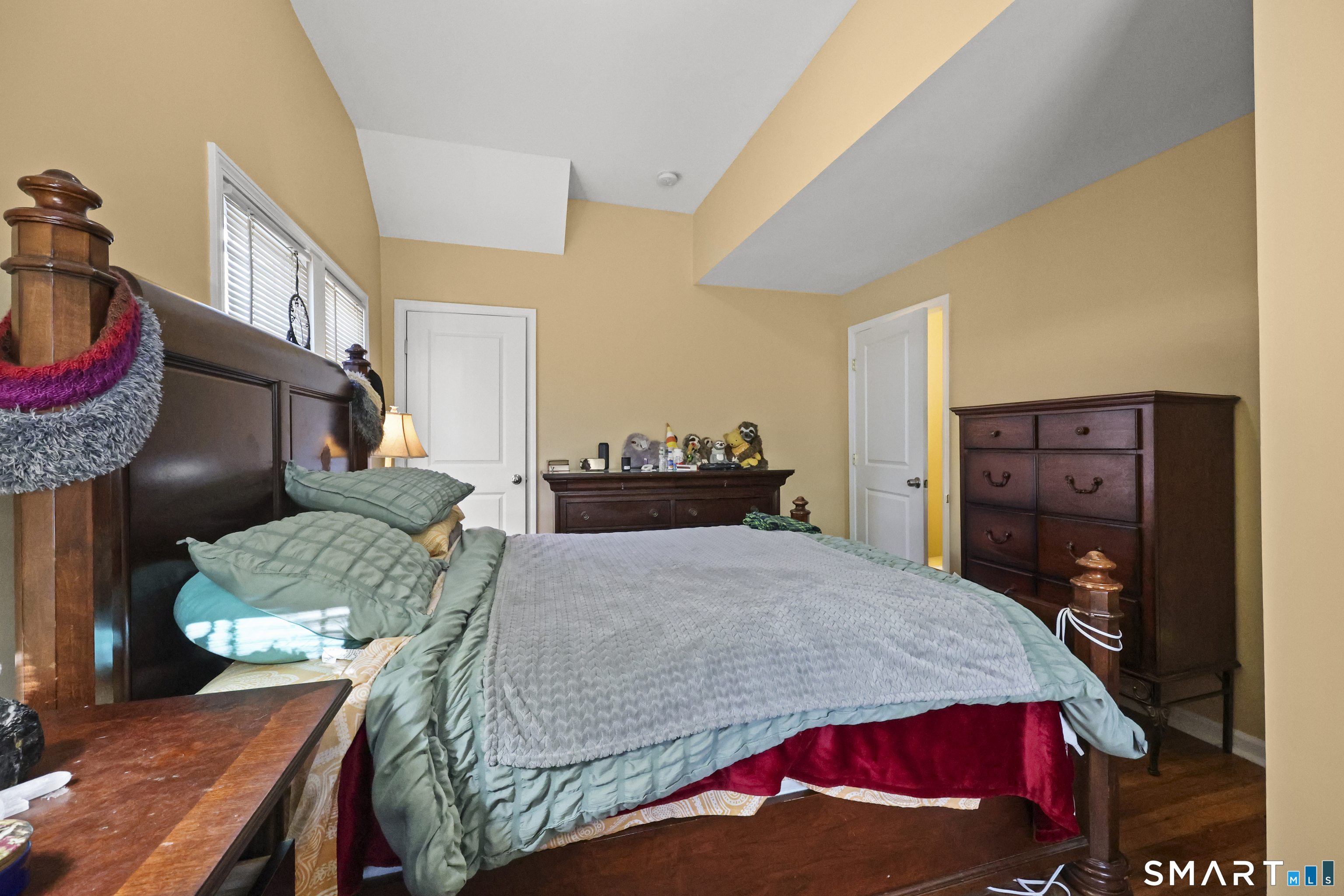 57 Foxon Place New Britain, CT 06053 - Photo 23 of 40 a bedroom with a bed a dresser and a painting on the wall