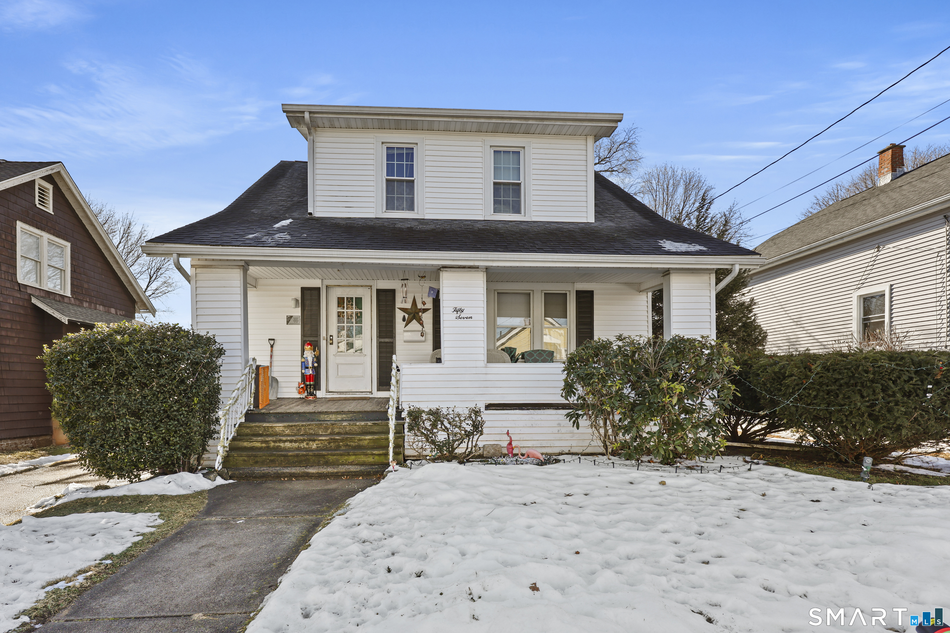 57 Foxon Place New Britain, CT 06053 - Photo 3 of 40 front view of a house with a bench