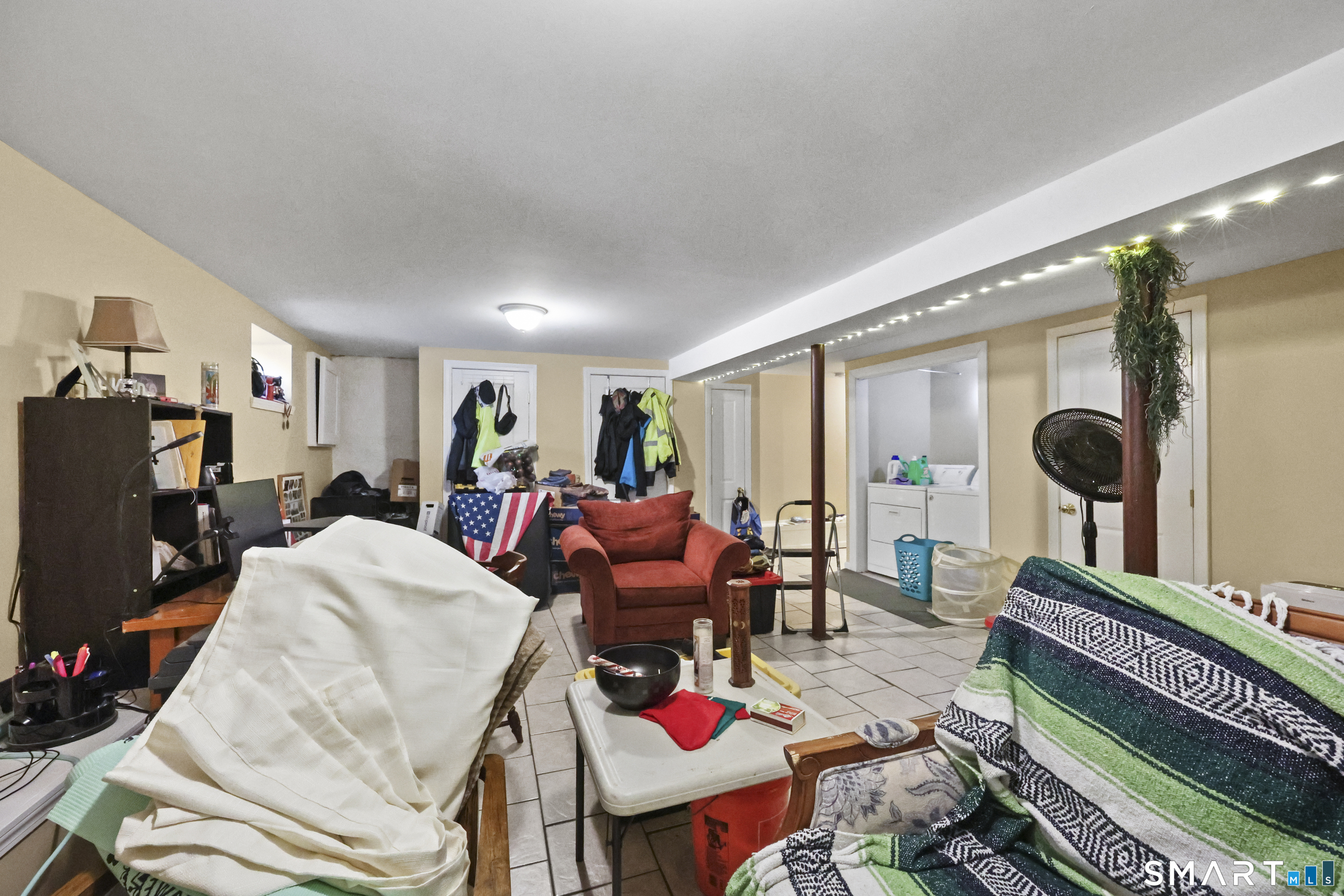 57 Foxon Place New Britain, CT 06053 - Photo 32 of 40 a living room with furniture a rug and a flat screen tv
