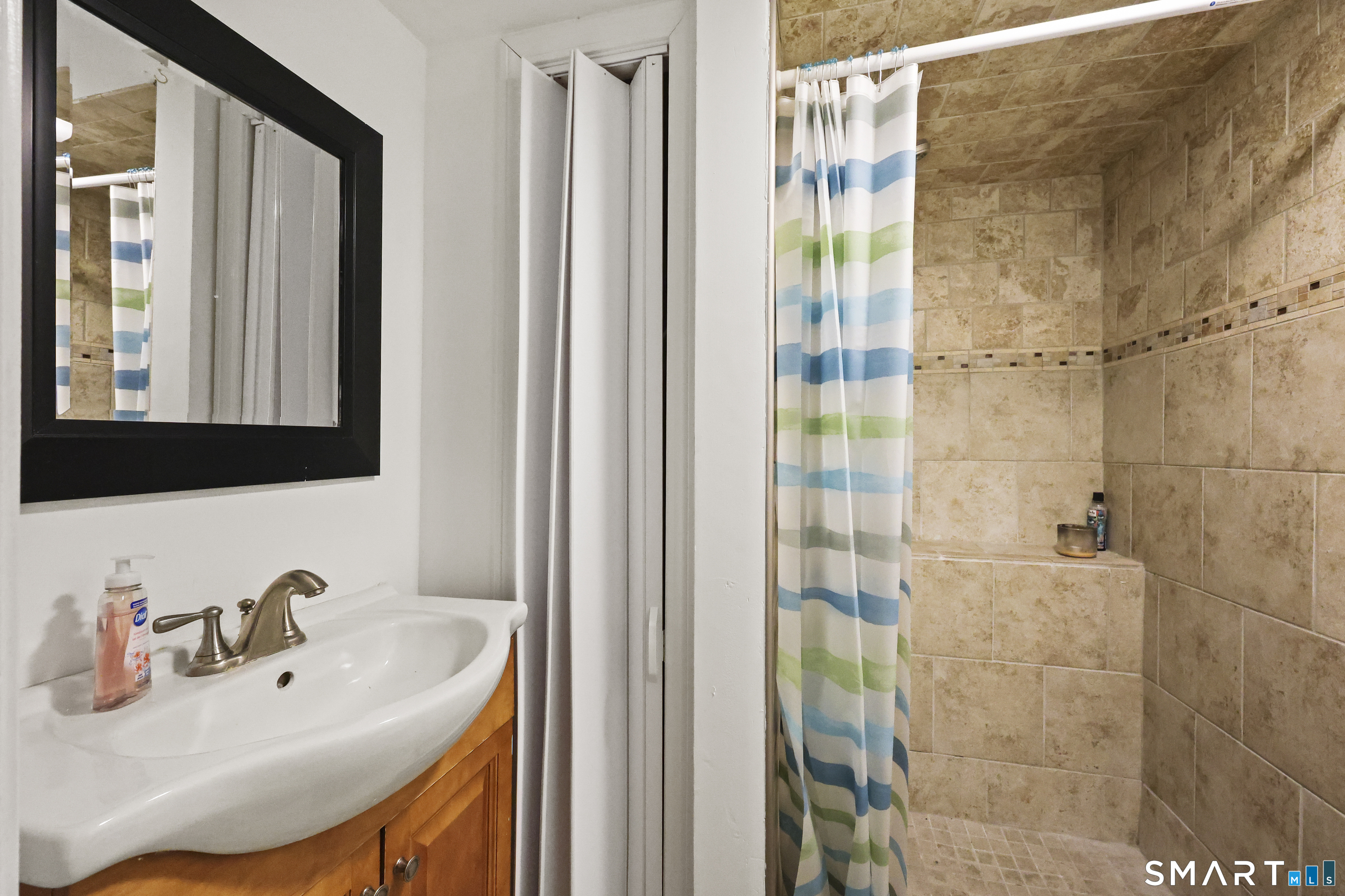 57 Foxon Place New Britain, CT 06053 - Photo 33 of 40 a bathroom with a sink and a mirror