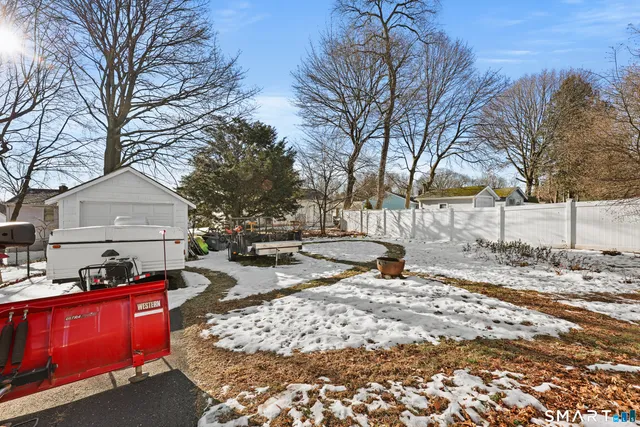 a street view with large trees