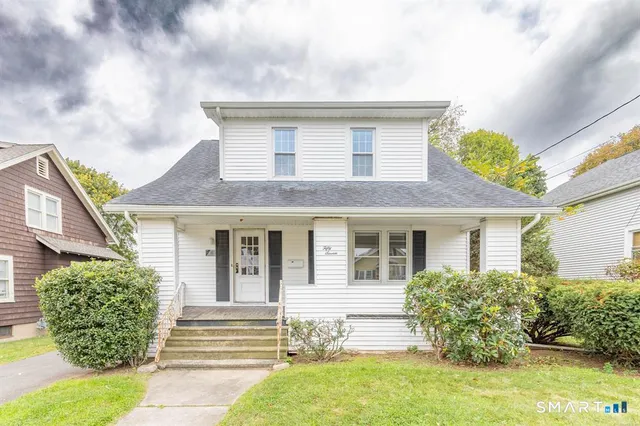 a view of a house with a window and garden